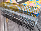 A spiral-bound notebook with a colorful cover is placed on a wooden surface.